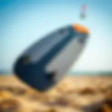 A close-up view of a carbon high modulus kiteboard showcasing its sleek design and texture