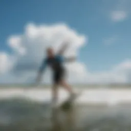Vibrant kiteboarding action against a clear blue sky