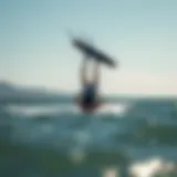 Kiteboarding Inverted Back Execution A kiteboarder executing an inverted back maneuver over the water