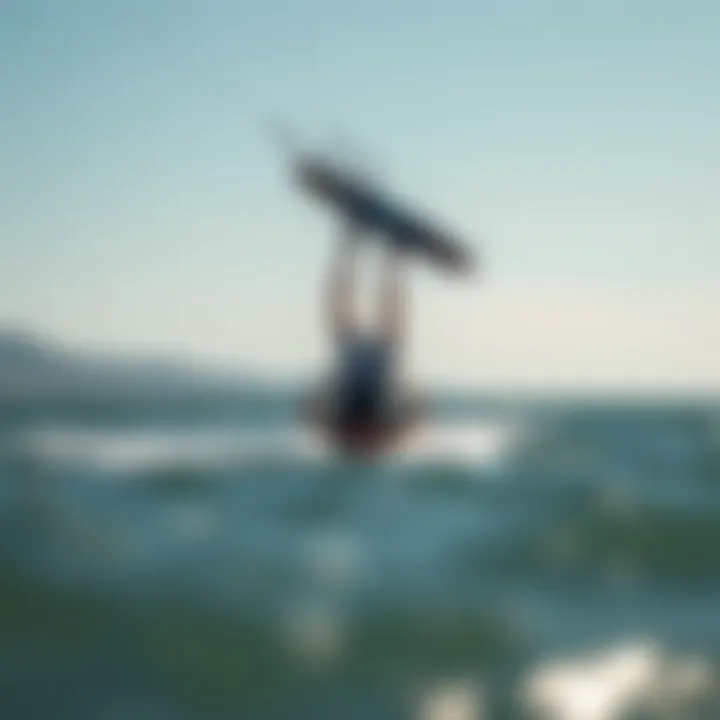 Kiteboarding Inverted Back Execution A kiteboarder executing an inverted back maneuver over the water