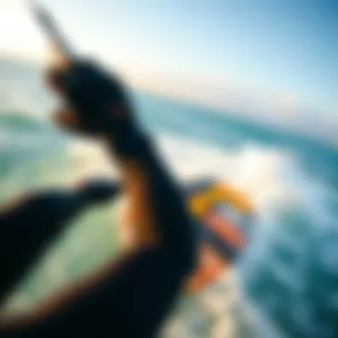 Kiteboarding with Enhanced Grip Kiteboarder wearing wetsuit mittens while navigating through waves.